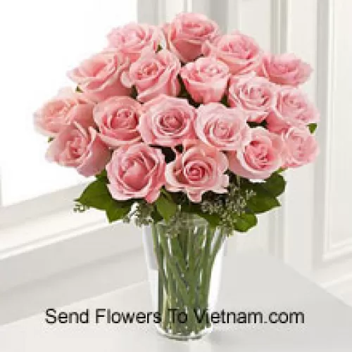 18 Pink Roses With Some Ferns In A Vase