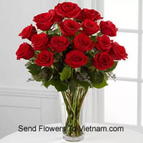 18 Red Roses With Some Ferns In A Vase