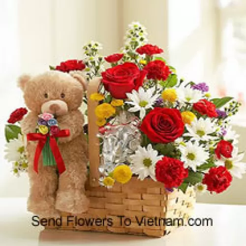 Cesto di fiori assortiti e un carino orsetto marrone di 6 pollici
