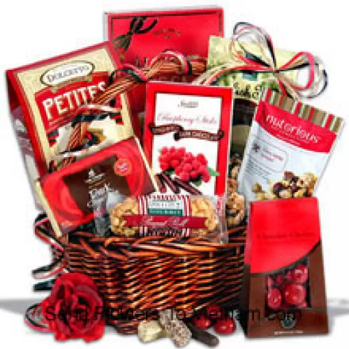 Un panier-cadeau exclusif pour la Saint-Valentin contenant des tablettes de chocolat noir, des petites gaufrettes au chocolat, des barres de toffee anglais, des cerises au chocolat, des confiseries aux noix et à la vanille de cerise, un rouleau de cacahuètes, des bâtonnets de chocolat noir à la framboise et une boîte de toffee au beurre Almond Roca (Veuillez noter que nous nous réservons le droit de substituer tout produit par un produit approprié de valeur égale en cas de non-disponibilité d'un certain produit)